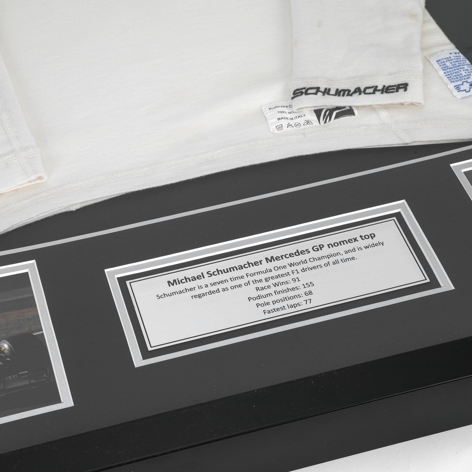 Season Launch LOT 027 - Michael Schumacher 2010 Mercedes Nomex - Framed