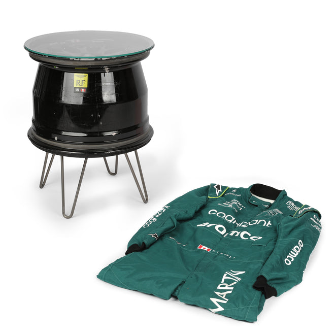 LOT 549 - Aston Martin Aramco Formula One® Team x Movember – Lance Stroll Suit & Wheel Rim