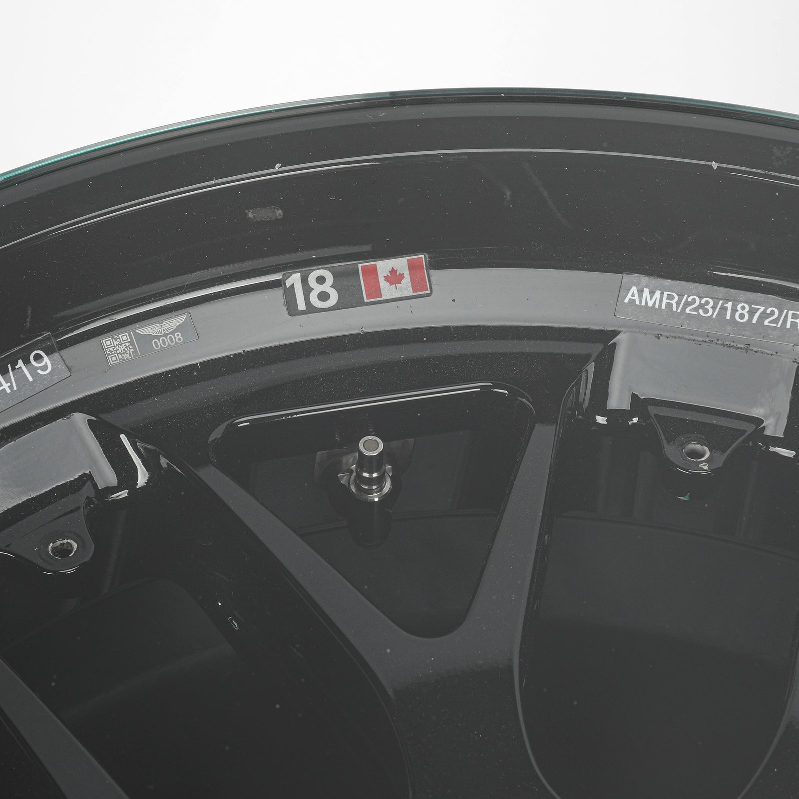 LOT 549 - Aston Martin Aramco Formula One® Team x Movember – Lance Stroll Suit & Wheel Rim