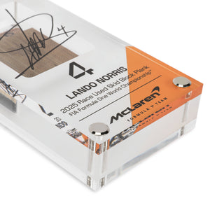 Lando Norris 2025 McLaren MCL39 acrylic display featuring a genuine Grand Prix-used skid plank piece from Formula 1 competition