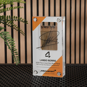 Lando Norris 2025 McLaren MCL39 Grand Prix-used skid plank piece, genuine Formula 1 race-used bodywork in an acrylic collector display
