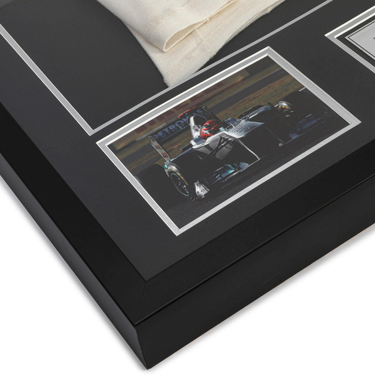 The Austin Auction LOT 013 - Michael Schumacher 2010 Mercedes Nomex - Framed
