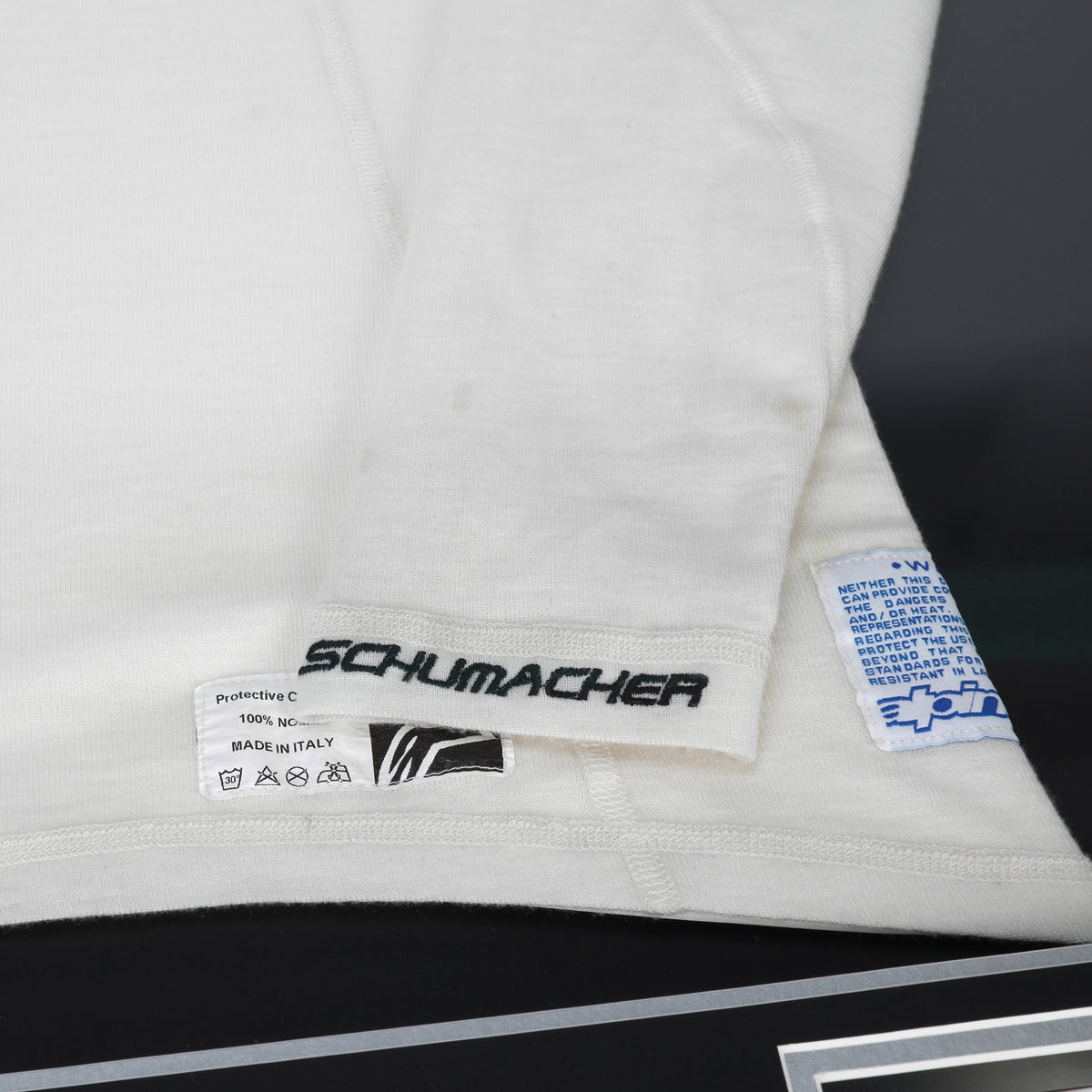 The Austin Auction LOT 013 - Michael Schumacher 2010 Mercedes Nomex - Framed