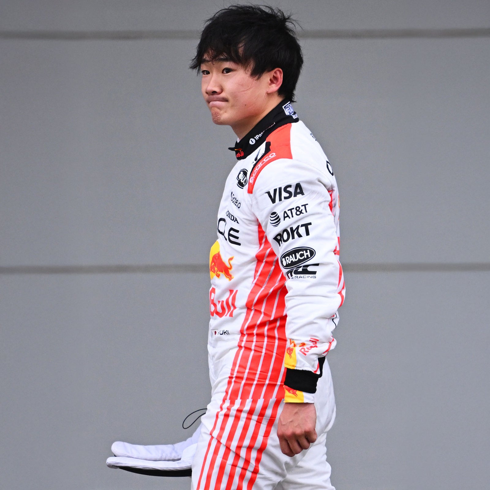 LOT 003 - Yuki Tsunoda 2025 Signed Race Weekend Used Race Suit - Japanese GP