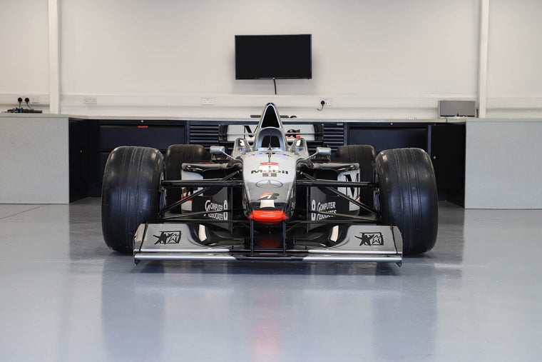 1997 McLaren MP4-12 Formula 1 show car, full-size collector display vehicle celebrating the iconic design of the McLaren race car